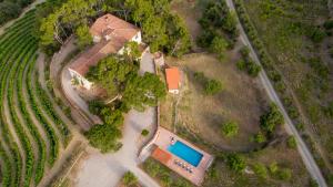 an aerial view of a house with a swimming pool at Mas Barbat in Lilla