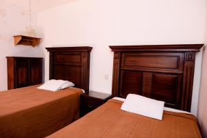 Postel nebo postele na pokoji v ubytování Hotel María Elena