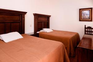 Postel nebo postele na pokoji v ubytování Hotel María Elena