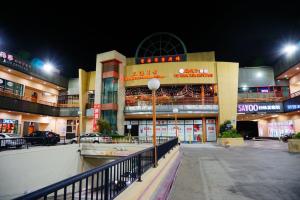 a building with a street light in front of it at night at Valley Hotel in Rosemead