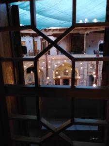 a view of a room through a window at Aist House in Bukhara