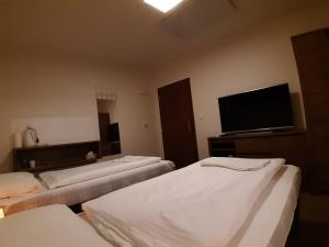 Postel nebo postele na pokoji v ubytování A7 Apartments