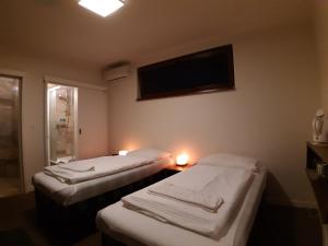 Postel nebo postele na pokoji v ubytování A7 Apartments