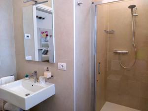 a bathroom with a sink and a shower at Le Mandragole B&B in Roncade