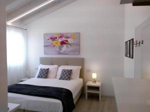 Postel nebo postele na pokoji v ubytování Le Mandragole B&B