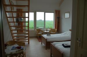 Postel nebo postele na pokoji v ubytování Boerderij "De Verwondering"