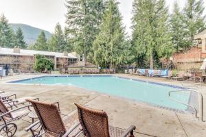 a large swimming pool with two chairs at Welches Fairway Retreat in Welches