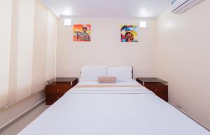 Postel nebo postele na pokoji v ubytování Hotel Marina Suites By GEH Suites