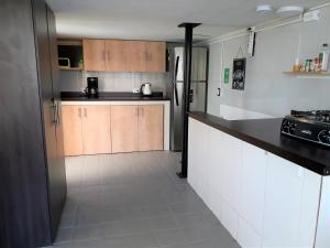 Kuchyň nebo kuchyňský kout v ubytování Noah boutique hostels Medellín