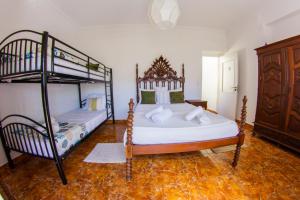 Ένα ή περισσότερα κρεβάτια σε δωμάτιο στο Lar dois coracões