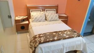 Postel nebo postele na pokoji v ubytování Gold Star Hotel