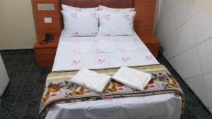 Postel nebo postele na pokoji v ubytování Gold Star Hotel