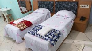Postel nebo postele na pokoji v ubytování Gold Star Hotel + 32 fotografií