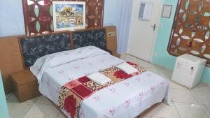 Postel nebo postele na pokoji v ubytování Gold Star Hotel