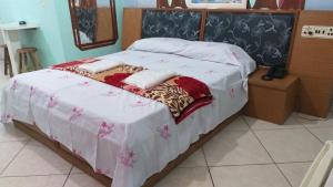 Postel nebo postele na pokoji v ubytování Gold Star Hotel