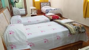 Postel nebo postele na pokoji v ubytování Gold Star Hotel