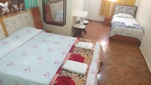 Postel nebo postele na pokoji v ubytování Gold Star Hotel