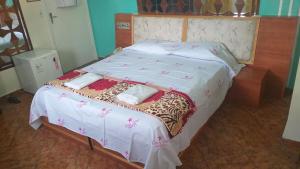 Postel nebo postele na pokoji v ubytování Gold Star Hotel