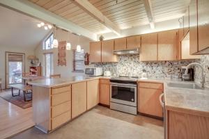 a kitchen with wooden cabinets and a counter top at 5 Butternut in Sunriver