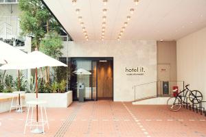 a lobby of a hospital building with aoked entrance at Hotel It Osaka Shinmachi in Osaka +79 photos