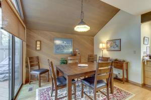 a dining room with a wooden table and chairs at Meadow House 76 | Discover Sunriver in Sunriver