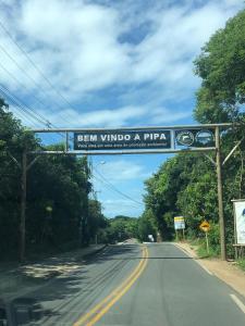 a sign that reads pen windward and pinea on a road at Apartamento A-11 Pipa Beleza Resort in Pipa