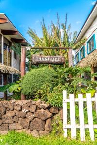 a sign that saysmark out in front of a house at Inaki Uhi Hotel in Hanga Roa