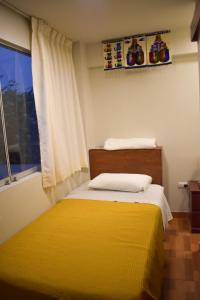 Postel nebo postele na pokoji v ubytování Casablanca Lima