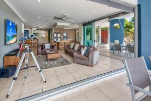 a camera on a tripod in a living room at Pavillions on Hamilton Island by HIHA in Hamilton Island