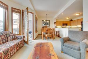 a living room with a couch and a table at Eagle Run 113 in Mammoth Lakes