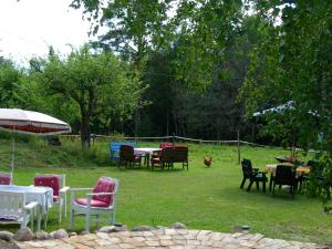 a group of chairs and tables in a yard at Wiborggården Bed and Breakfast in Boda +30 photos