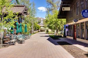 a sidewalk with tables and chairs and a building at Sun Valley Atelier Studio - Serenade in Sun Valley