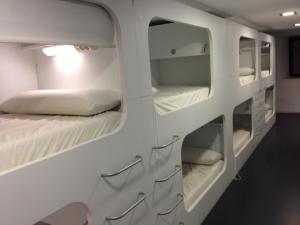 a bed room with two bunk beds and a window at Hostel Casa Ibarrola in Pamplona