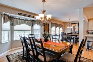a dining room with a wooden table and chairs at Oaks at Wasatch #7 in Cottonwood Heights