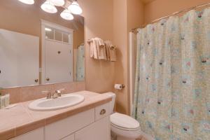 a bathroom with a sink and a toilet and a shower at Surf's Edge in Rockaway Beach +28 photos
