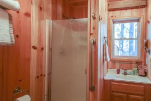 a bathroom with a shower and a sink at Cozy Bobby Grey Manor in South Lake Tahoe +19 photos
