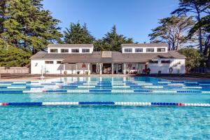 a swimming pool in front of a house at Compass Rose in Sea Ranch