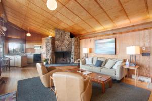 a living room with a couch and a fireplace at Curtis-Moulton Retreat in Sea Ranch