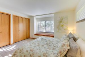 a bedroom with a bed and a window at Fairway Village 28 | Discover Sunriver in Sunriver +27 photos