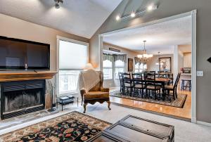 a living room with a fireplace and a dining room at Oaks at Wasatch #7 in Cottonwood Heights
