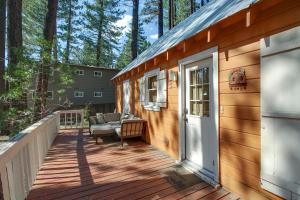 a porch of a wooden house with a door at Cozy Bobby Grey Manor in South Lake Tahoe