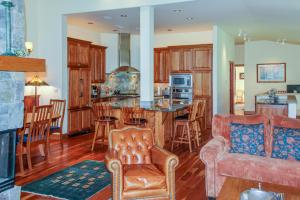 a kitchen and living room with a couch and a table at Legends - Simply Perfect Elkhorn Retreat in Sun Valley