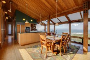 a kitchen and dining room with a table and chairs at Compass Rose in Sea Ranch