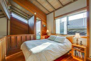 a bedroom with a large bed with a window at Vista Grande in Sea Ranch