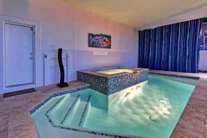 an indoor pool with a spa in the middle of a room at Wine Down in Ilexhurst