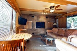 a living room with a couch and a table at The Cottage in Shaver Lake