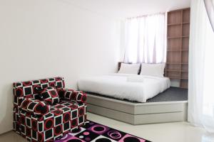 Ένα ή περισσότερα κρεβάτια σε δωμάτιο στο Modern City View Studio Apartment at Tuscany Residences By Travelio +5 φωτογραφίες