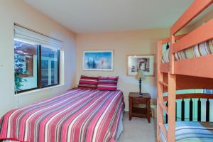 a bedroom with a bed and a bunk bed at The Bridges 102 in Mammoth Lakes