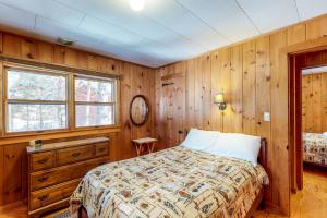 Voodi või voodid majutusasutuse Breakwater Lodge toas