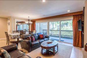 a living room with a couch and a table at Cedars West in Incline Village